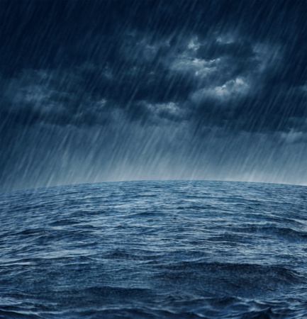 Dark stormy clouds over the oceanの写真素材