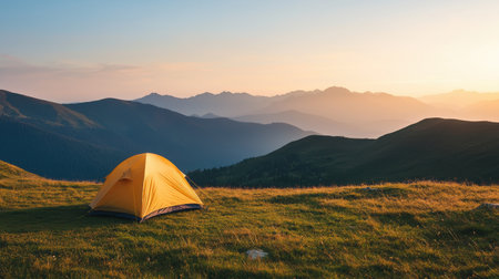 Peaceful Serenity of a Yellow Tent Sitting in Majestic Mountain Landscape During Sunrise with Soft Colors and Breathtaking Natural Beautyの素材