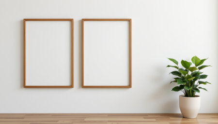 Minimalist Interior Design Concept Featuring Two Empty Frames, Wood Floor, Decorative Plant, and a Bright White Wall for Fresh and Modern Aestheticの素材