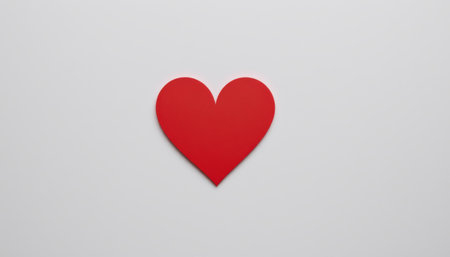 Vibrant Red Heart Cutout on Minimalistic White Background for Creative Designs, Valentines Day, Love Themes, and Emotional Expressionsの素材