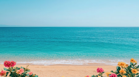 Tranquil Beach Scene with Vibrant Flowers Framing Clear Blue Water and Sandy Shore on a Sunny Day Under a Bright Cloudless Skyの素材