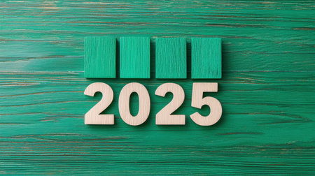 Creative Wood Blocks Arrange to Form the Year 2025 on a Bright Green Background with Textured Surface Ideal for New Year Themes and Celebrationsの素材