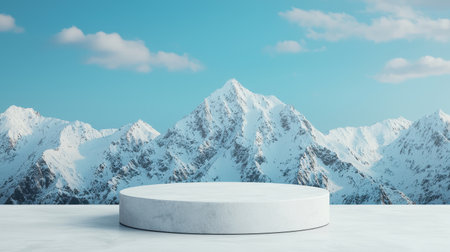 Scenic snowy mountain landscape with a circular podium in the foreground under a bright blue sky featuring fluffy clouds and beautiful peaksの素材