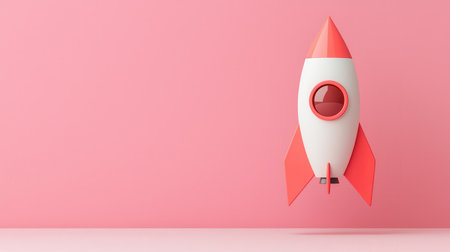 Colorful Retro Rocket Ship Launching Against a Soft Pink Background for Creative and Inspirational Themes in Art and Design Projectsの素材