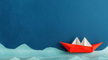 A vibrant red origami boat sails on a textured blue background, surrounded by soft green waves, creating a whimsical and serene atmosphere.の素材