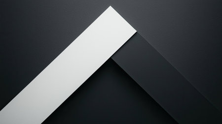 A minimalist design featuring a white and black angled shape against a dark background, emphasizing contrast and modern aesthetics.の素材