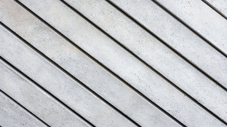 A close-up view of diagonal wooden planks, showcasing their textured surface and natural colors, creating a rustic and modern aesthetic.の素材