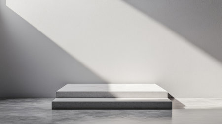 A minimalist interior scene featuring a raised platform bathed in soft light, creating a serene and modern aesthetic.の素材