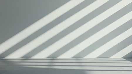 A minimalist image showcasing diagonal shadows cast on a light-colored wall, creating an intriguing interplay of light and texture.の素材