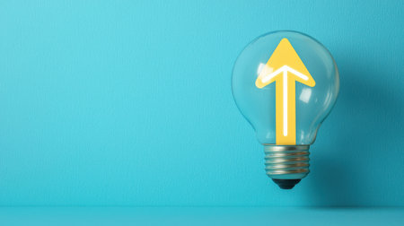 Light bulb with yellow arrow symbolizing innovation, creativity, and progress on a vibrant blue background for modern concepts and ideas in designの素材