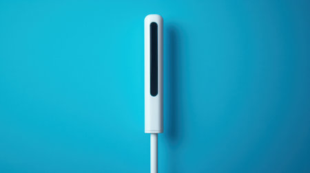 Modern sleek smart home door sensor device with magnetic strip for security system mounted on vibrant blue wall, minimalistic technology accessory for smart home.の素材