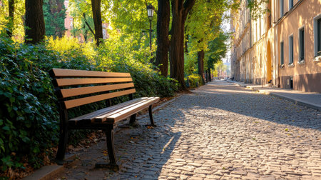 A serene park scene featuring a wooden bench along a cobblestone path.の素材