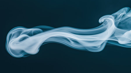 Swirling wisps of delicate white smoke on a dark background, creating ethereal abstract patternsの素材