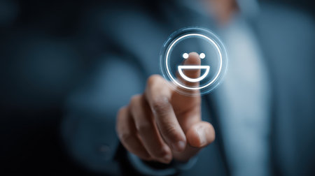 Businessman Touching Digital Icon of Smile Emotion on Screen Representing Customer Satisfaction and Positive Interaction in Modern Workplaceの素材