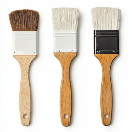 Three Different Brushes with Wooden Handles and Varied Bristle Types Perfect for Painting, Crafting, Decorating, or Home Improvement Projectsの素材