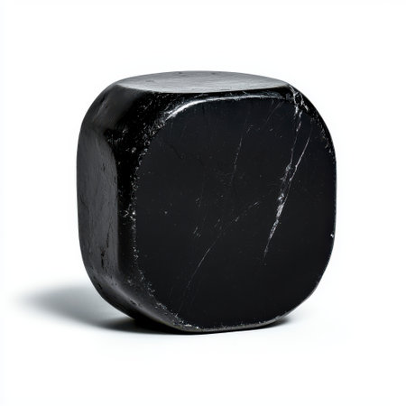 Smooth black stone sculpture with round edges on white background perfect for modern art display or minimalistic interior design decorの素材
