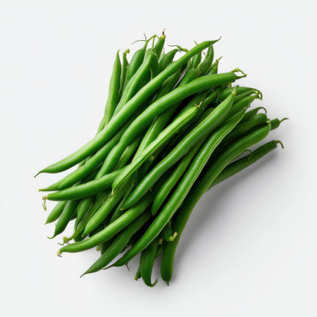 Fresh Green Beans Piled Neatly on White Background for Healthy Eating and Culinary Use in Recipes, Meals, and Cooking Demonstrationsの素材
