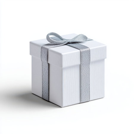 Elegant white gift box with silver ribbon on a clean background, perfect for celebrations, holidays, and special occasions, emphasizing luxury and simplicityの素材