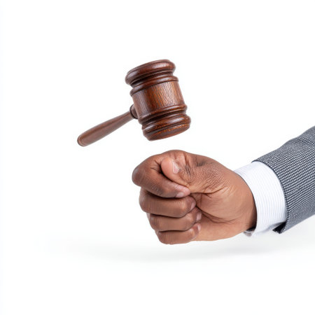 Serious Businessman Holding Gavel Ready to Make Important Decision in Courtroom Environment Focus on Legal Authority and Judicial Process in Justice Systemの素材