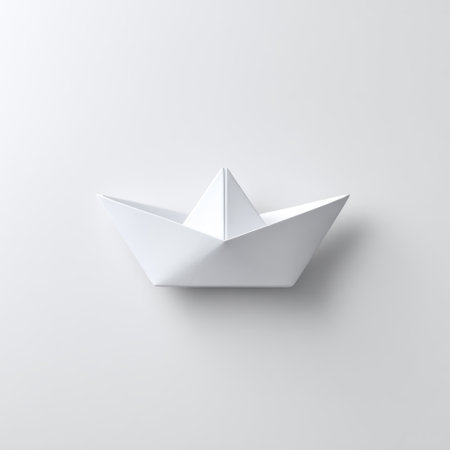 Elegant White Paper Boat on Minimalist Background Representing Creativity, Imagination, and Simplicity in Design and Art Conceptsの素材