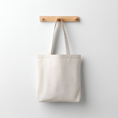 Minimalist Cotton Tote Bag Hanging on Wood Hook, Ideal for Eco-Friendly Shopping, Sustainable Lifestyle, and Everyday Use in Modern Home Decorの素材