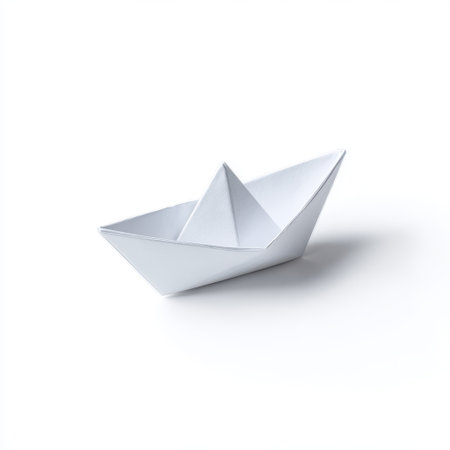 Simple White Paper Boat Floating on a Clean Surface with Soft Shadows, Symbolizing Imagination, Creativity, and Peaceful Childhood Memoriesの素材