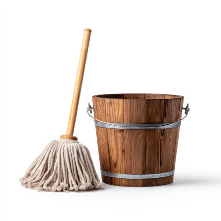Clean Mop and Wooden Bucket for Household Cleaning Supplies in a Minimalistic Studio Settingの素材