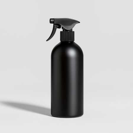 Sleek Black Spray Bottle with Trigger Top on Light Gray Background for Cleaning, Haircare, or DIY Projectsの素材