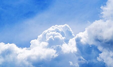 white fluffy clouds in the blue sky