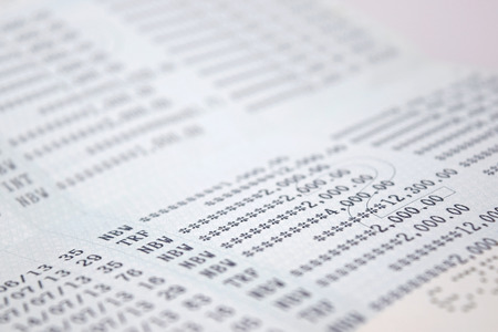 The numbers on the bank account abstract backgroundの写真素材