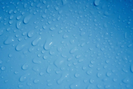 Water drop on Blue Background defocusの写真素材