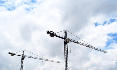 Construction cranes and Buildings and  sky backgroundの写真素材