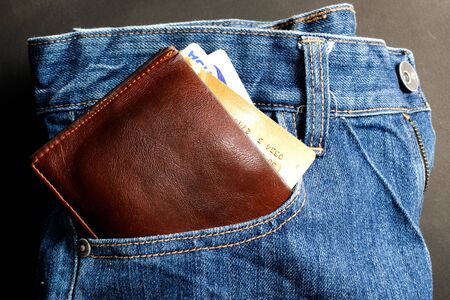 Leather wallet Credit card  on jean backgroundの写真素材