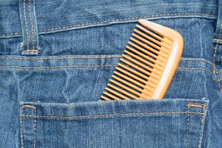Comb in jean pocket backgroundの写真素材