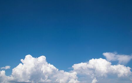 white fluffy clouds in the blue sky
