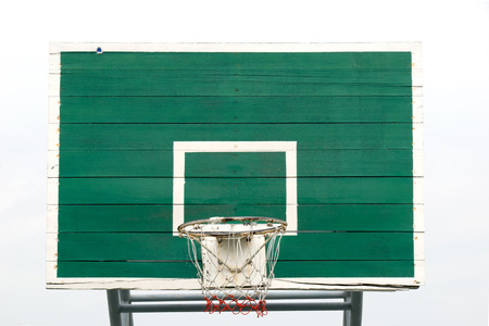 Basketball Hoop  - Outdoor basketball hoop and green backboard, taken from a front view. Isolated on sky background.の写真素材
