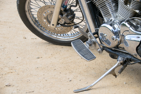 Close up Wheel and Stand motorcycle chopper on the floor.