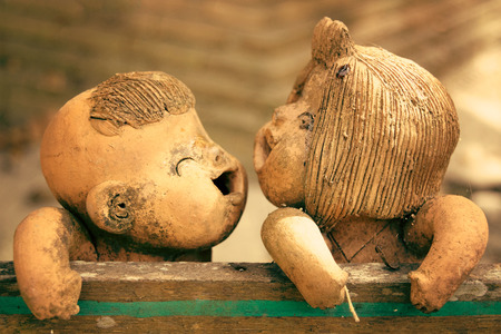 Close up Boy and Girl Clay sculpture turn to face