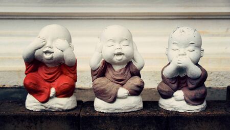 Sculpture dolls novice closed eyes closed hearing and close nose ( This statue is an element in the Thai Temple, Public area )の写真素材