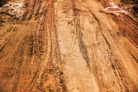 Close up Tire marks on the Dirt roadの写真素材