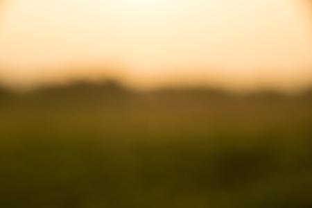 landscape fields and sky in evening time abstract blur backgroundの写真素材