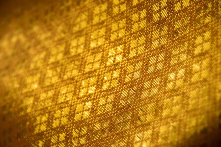 Close up Golden fabric abstract backgroundの写真素材