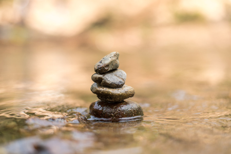 Close up Stone stacked on water river