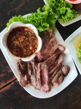 Thai style nortwestern local beef marinated grilled with spicy dipping sauceの写真素材