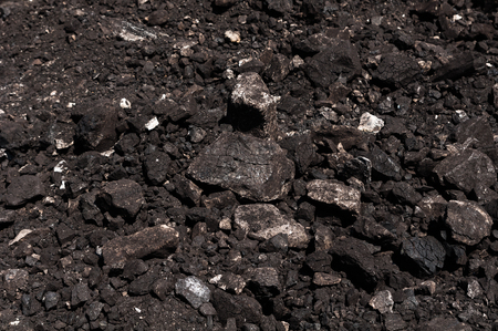 Coal used as fuel for heavy industrial coal powered electricity plant. Coal mineral black stone background. Coal is a variety of solid, combustible, sedimentary, organic rocks, formed from vegetation that has been consolidated between other rock strata and altered by the combined effects of pressure and heat over millions of years.の写真素材
