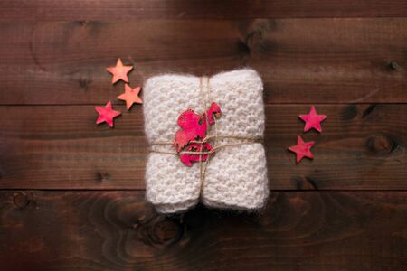 Knitted snood with stars and angel look like giftの写真素材