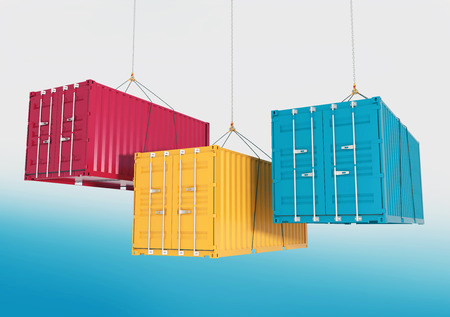Three metal freight shipping containers red, yellow and blue on the hooks at sky background -...