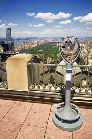 Zoom binoculars on Rockefeller Center with view on a Manhattan Central Park in NYCの写真素材