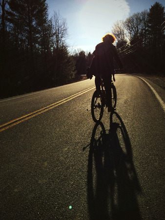 Riding mountain bike in the forestの写真素材