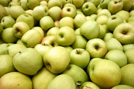 Green apples on sale at the local market background